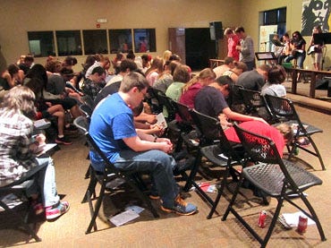 The youths of First United Methodist Church attend a recent service. The church's youth program has expanded rapidly, from 10 people to 90 in three years.