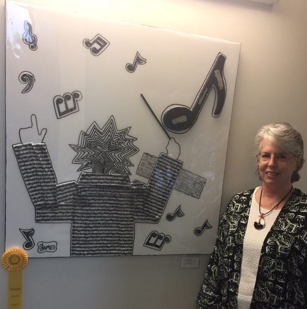 Sharon James stands with "Yankee Doodle," for which she won an honorable mention award in the Okaloosa Public Arts show Sept. 16 in Shalimar. (Special to the News Bulletin)