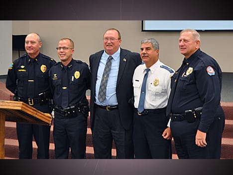 Niceville police Chief David Popwell, Shalimar police Chief John Cash, Crestview police chief Tony Taylor, Valparaiso police Chief Joe Hart and Fort Walton Beach police Chief Ted Litschauer pose for a picture together after Taylor was sworn in.