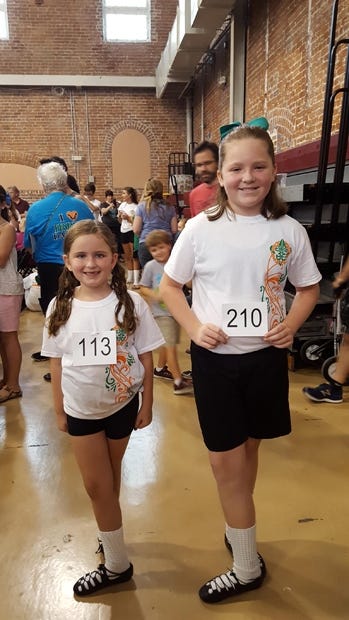 Kaylyn Converse (left), 7, and Ireland Curtis, 9, are pictured at an Irish Dance competition Sept. 17 in New Orleans, Louisiana. They both placed in their levels. (Special to the News Bulletin)
