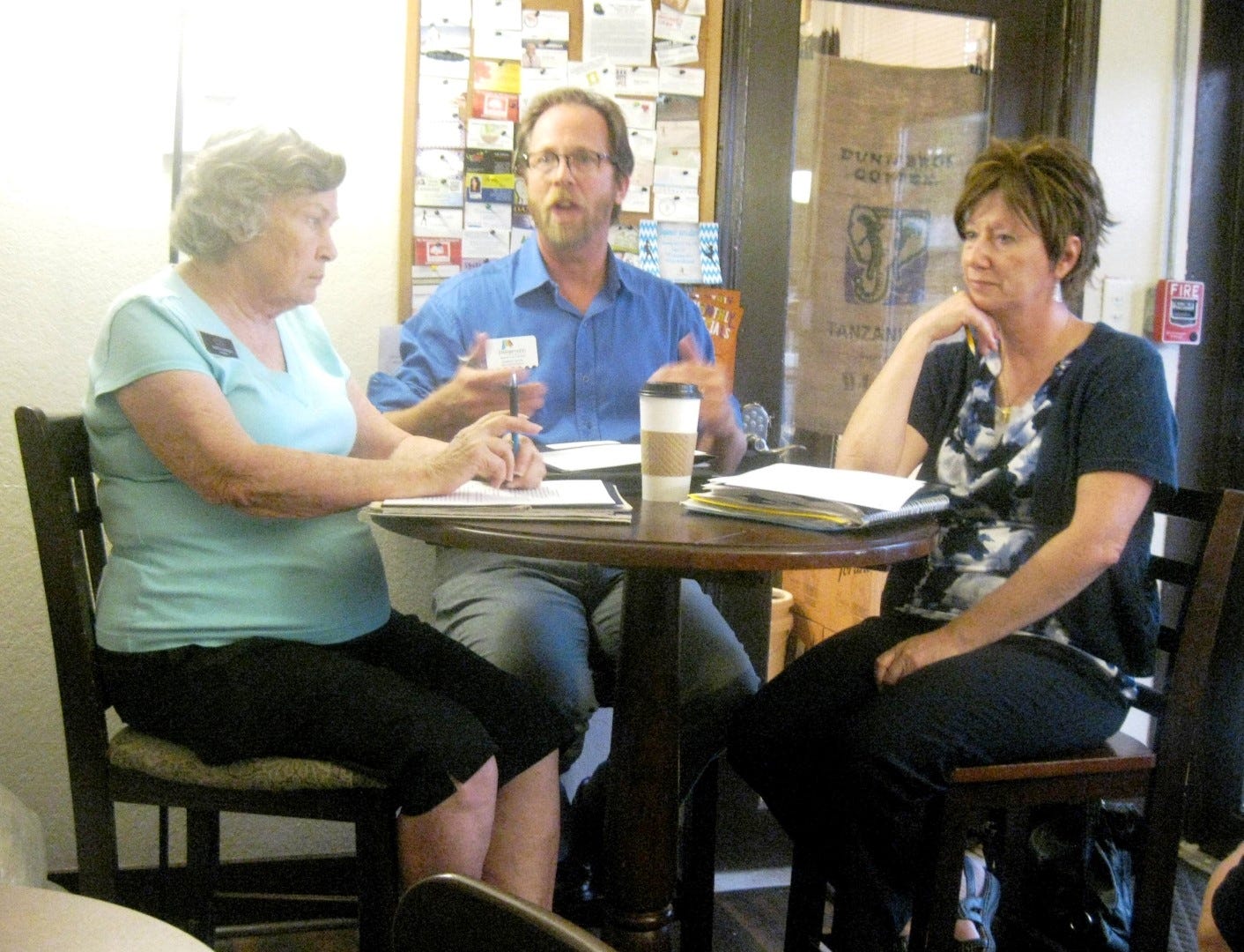 Flanked by Main Street Crestview Association Director Patti Gonzo and Community Redevelopment Agency Director Brenda Smith, Petermann Agency senior account executive Stephen Smith describes his marketing firm’s plans to downtown merchants Sept. 20. (BRIAN HUGHES | News Bulletin)