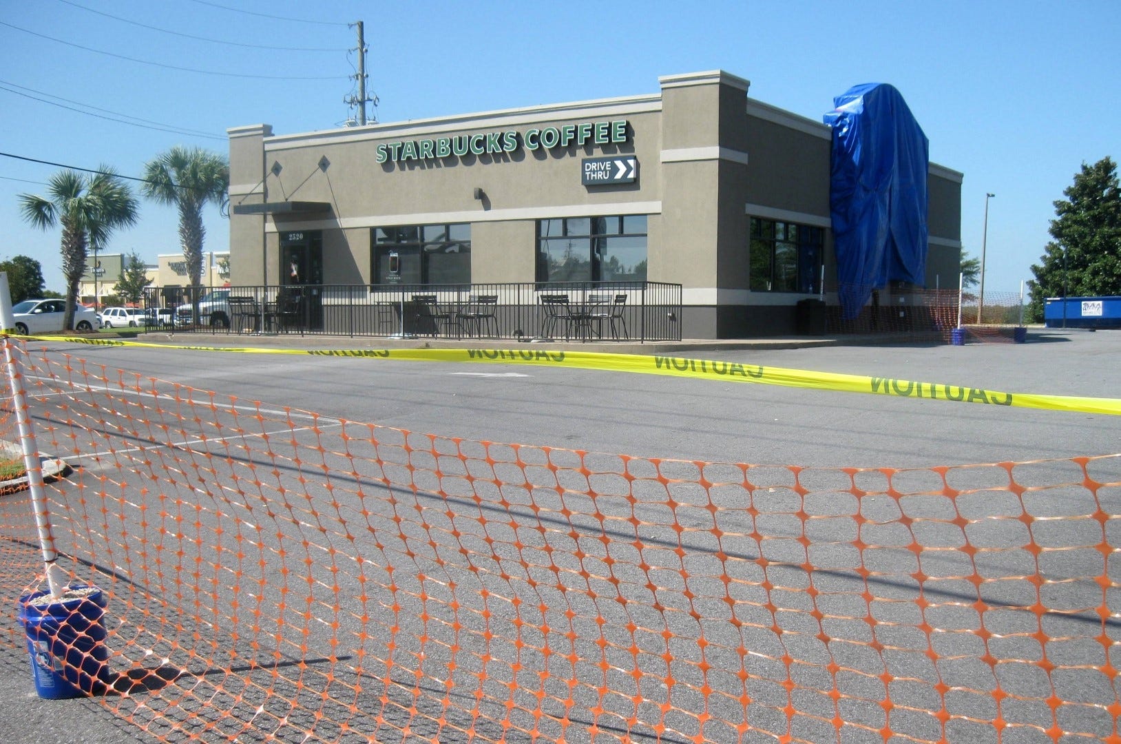 Entrances to the Crestview Starbucks are barricaded while the business undergoes repairs following a Sept. 16 accident in which a truck hit the entrance awning, pulling it off the building. (BRIAN HUGHES | News Bulletin)