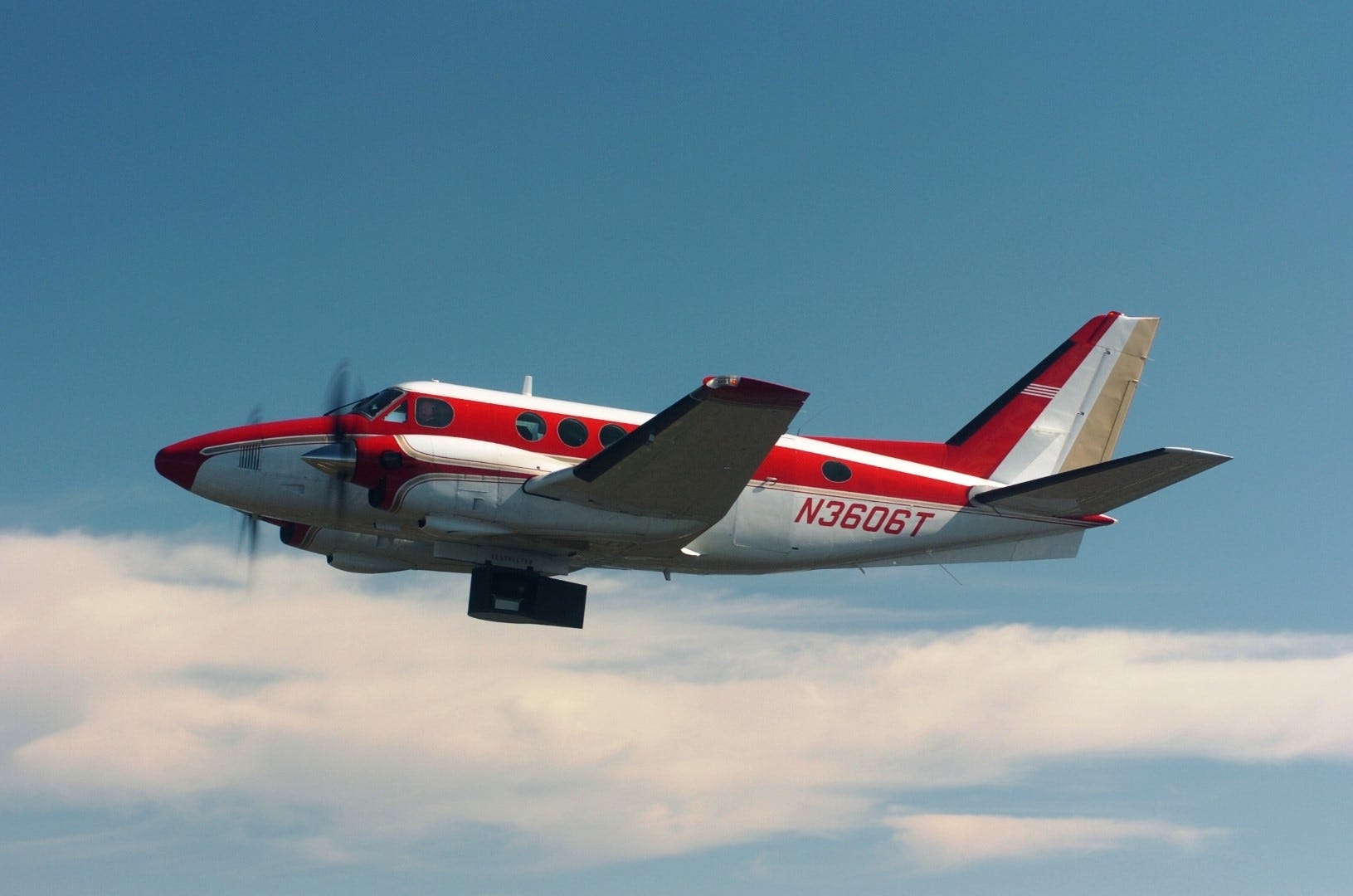 Sunshine Aero Flight's King Air aircraft flies a mission testing an infrared missile detector pod, which hangs below the fuselage, during Eglin Air Force Base’s Sensor Week in May.

(BRIAN HUGHES | News Bulletin)