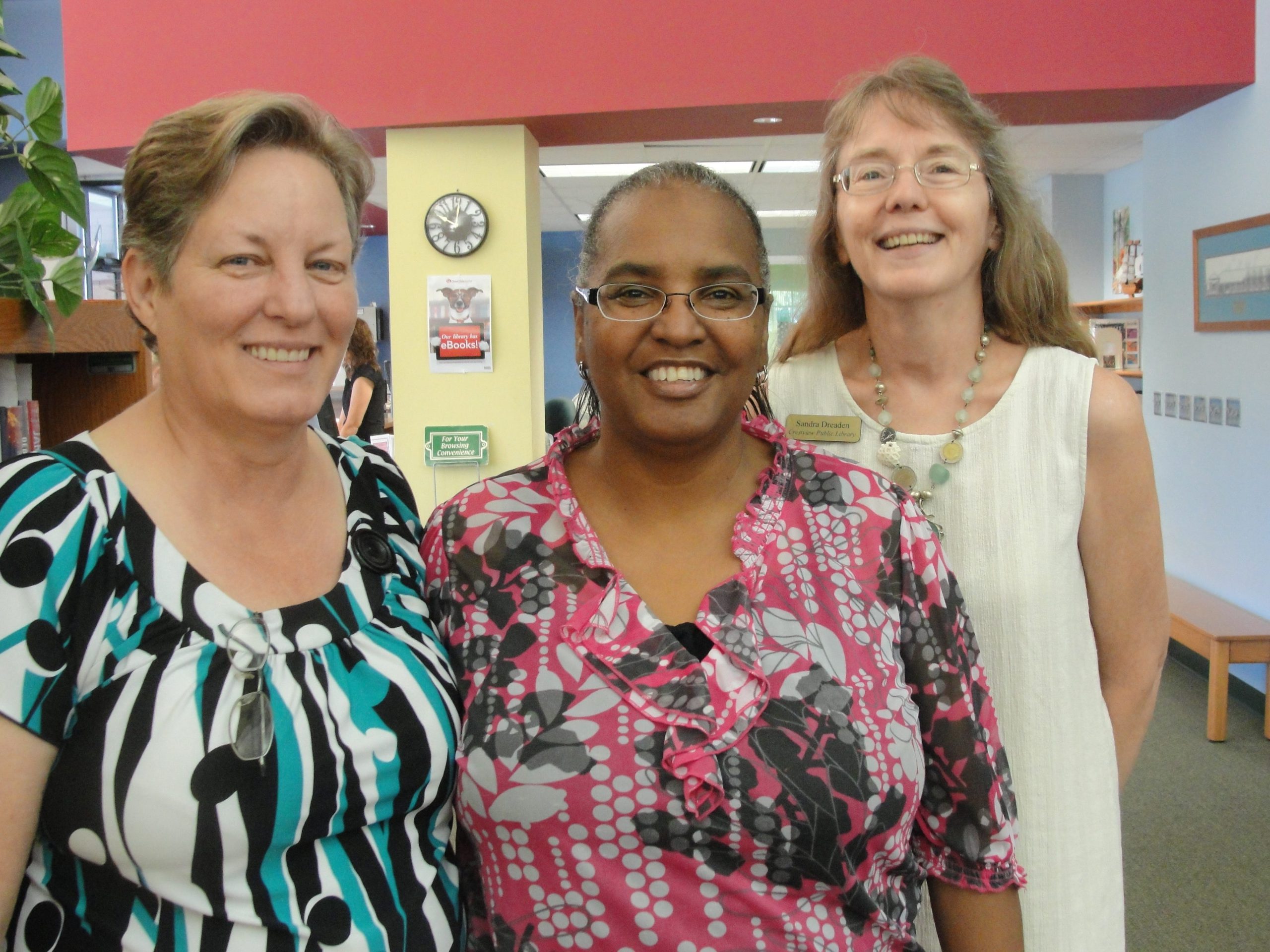 Anna Florence has worked with Sabrina Sturdivant, left, and Sandra Dreaden at the Crestview Public Library for many years. SAMANTHA LAMBERT | Crestview News Bulletin