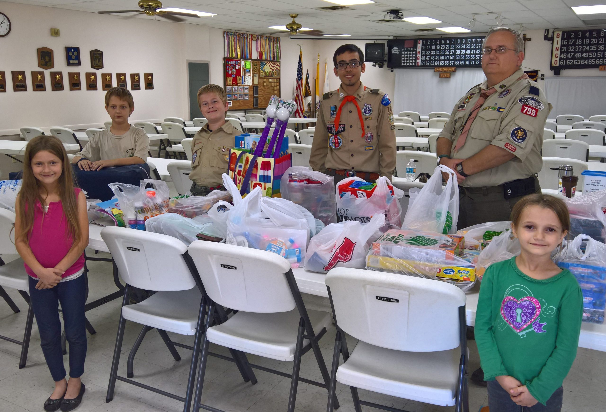 Front row, from left: Josey Humphrey and Bernadette Humphrey of Girl Scout Troop 738. Back row: Johnny Humphrey of Troop 773; Ben Humphrey of Pack 799; Austin Carrico of Troop 773; and John Humphrey, cubmaster of Pack 799 and chartered organization representative of Troop 773. (CATHY HUMPHREY | Special to the News Bulletin)