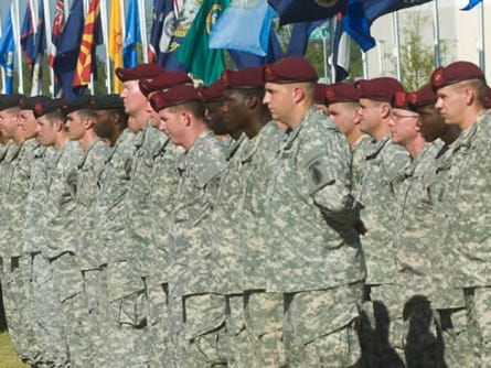 Members of the 4th Battalion stand at ease during a ceremony.