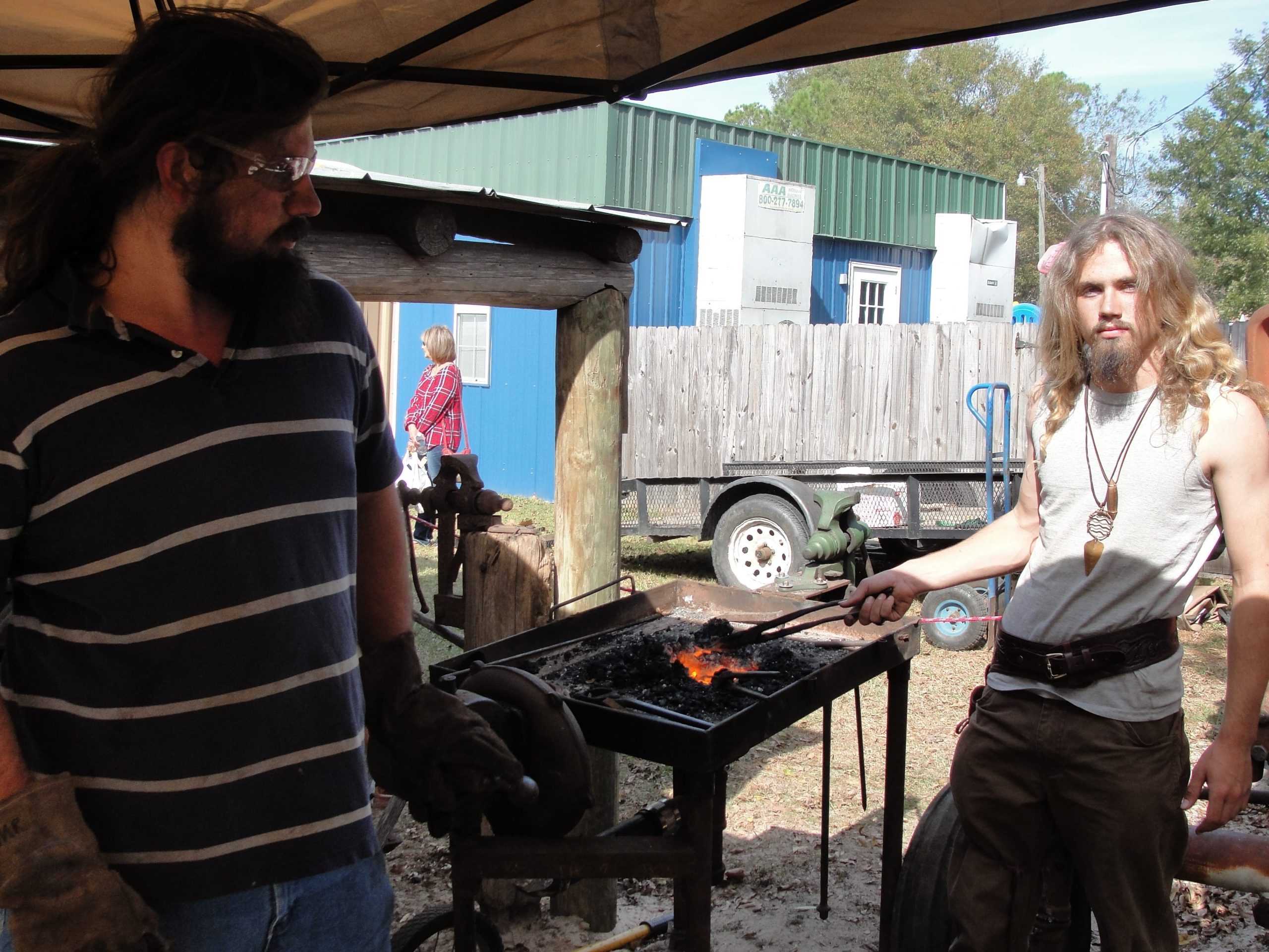 Brothers Wyatt and Waylon Perry demonstrate the art of blacksmithing. SAMANTHA LAMBERT | News Bulletin
