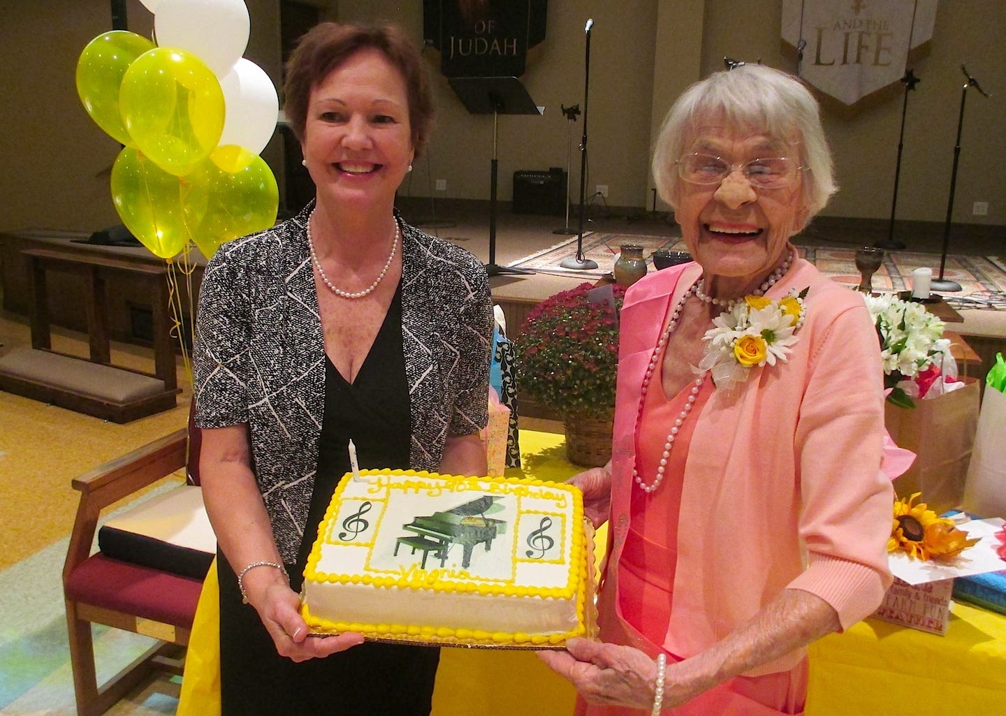 Virginia Kemp, right, laughs at a joke during her 90th birthday party Nov. 5 as she and her daughter, Martha Barton, display her birthday cake. BRIAN HUGHES | Special to the News Bulletin