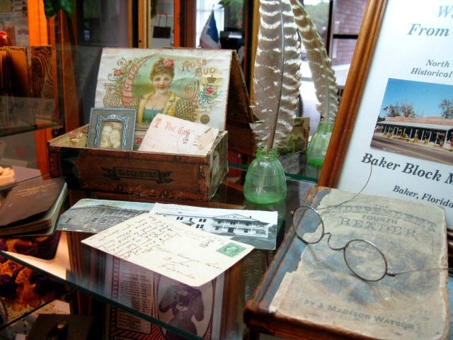 Old postcards, greeting cards and school books are among Baker Block Museum materials on display at the Crestview Public Library.