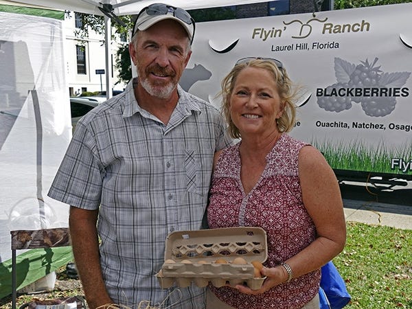 Randy and Tracey Duncan sell eggs, pork and beef at the Saturday morning Palafox Farmers Market in Pensacola. (Special to the News Bulletin)