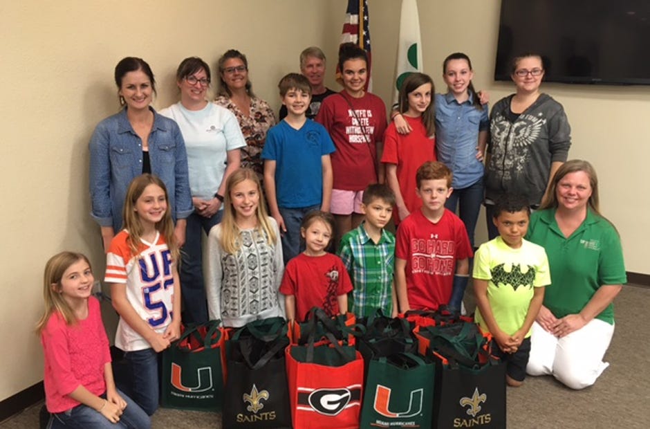 The 4-H Country Club and Feathers and Fur 4-H Club members pictured here collected donations for cold night shelters in Okaloosa County. Special to the News Bulletin