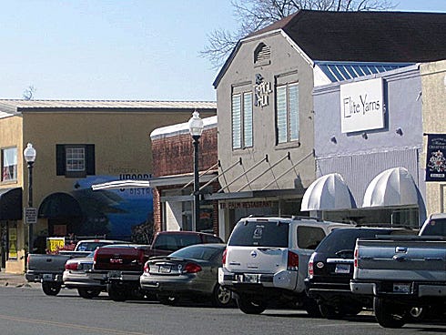 City officials hope rezoning downtown to permit residential units above businesses will encourage shops and restaurants to stay open later.