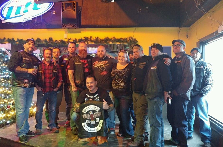 Wingmen Motorcycle Club members present money collected as part of a poker run benefit they held for the McDougald family of Crestview. Members presented $1,180 to them, and also gave them numerous furniture and kitchen items that had been donated for the event. The McDougalds lost their home and most of its contents in an Oct. 27 fire. Special to the News Bulletin