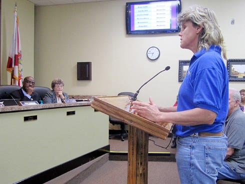 Jane Swift, local project manager for water consultants CH2M Hill, offers her company's support for an environmental technology expo in Crestview during Monday's city council meeting.