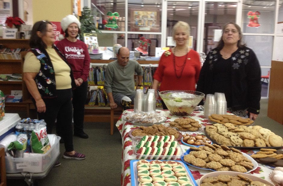 Members of the Friends of the Library prepare to host their most recent Noel Night at the Crestview Library. DOT MOXCEY | Friends of the Library