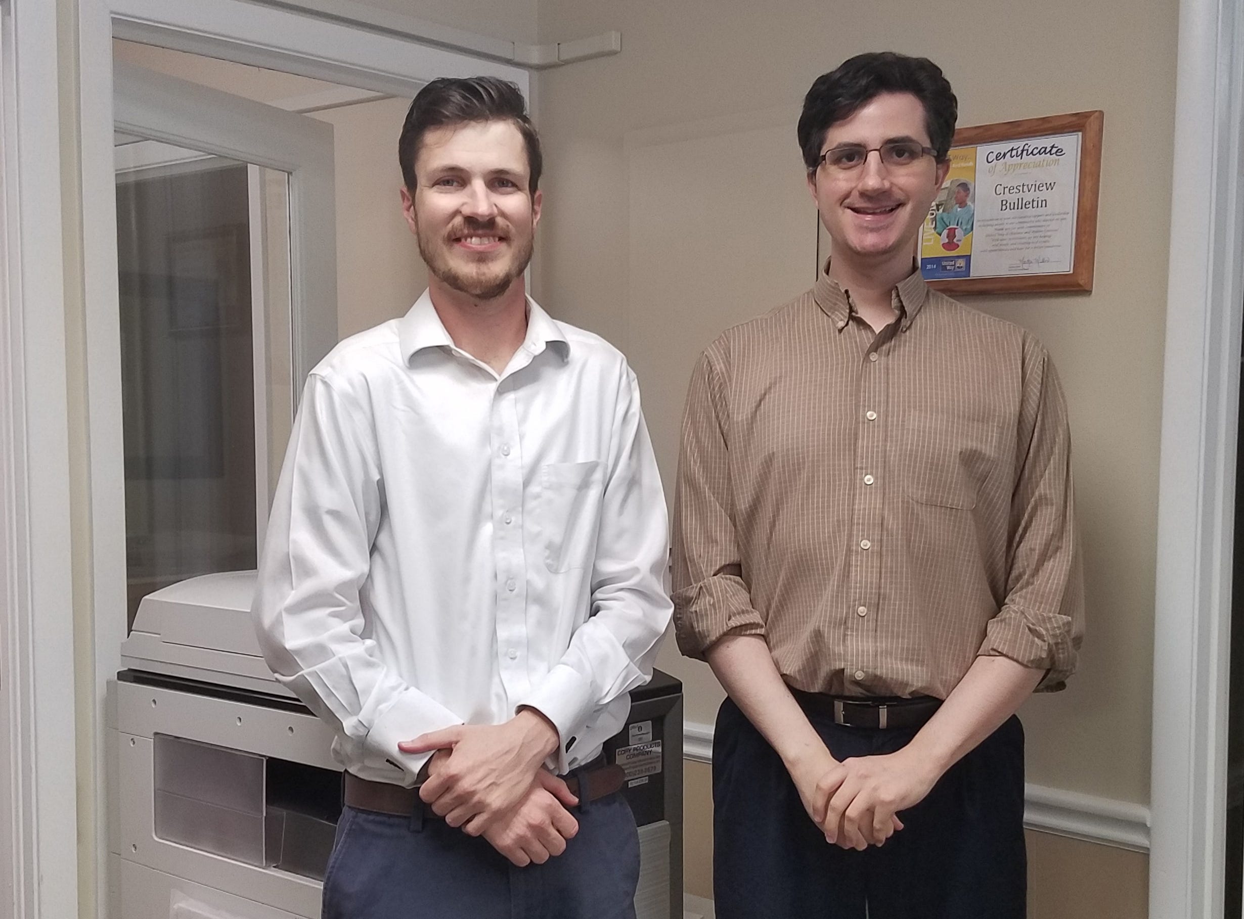 “Mark will build his journalism career at the News Bulletin, but he is no stranger to hard news and the needs of a 21st-century newsroom,” Crestview News Bulletin Editor Thomas Boni said. Pictured: Mark Judson, left, with Boni. (HOLLY MANEVAL | News Bulletin)