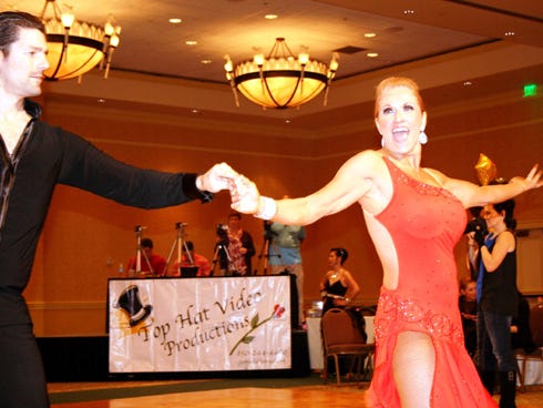 Crestview dance student Kim Moore, shown dancing in competition with instructor Chris Schultz, won the Best New Student Competitor trophy during a regional dance competition at Baytowne Wharf in Sandestin.
