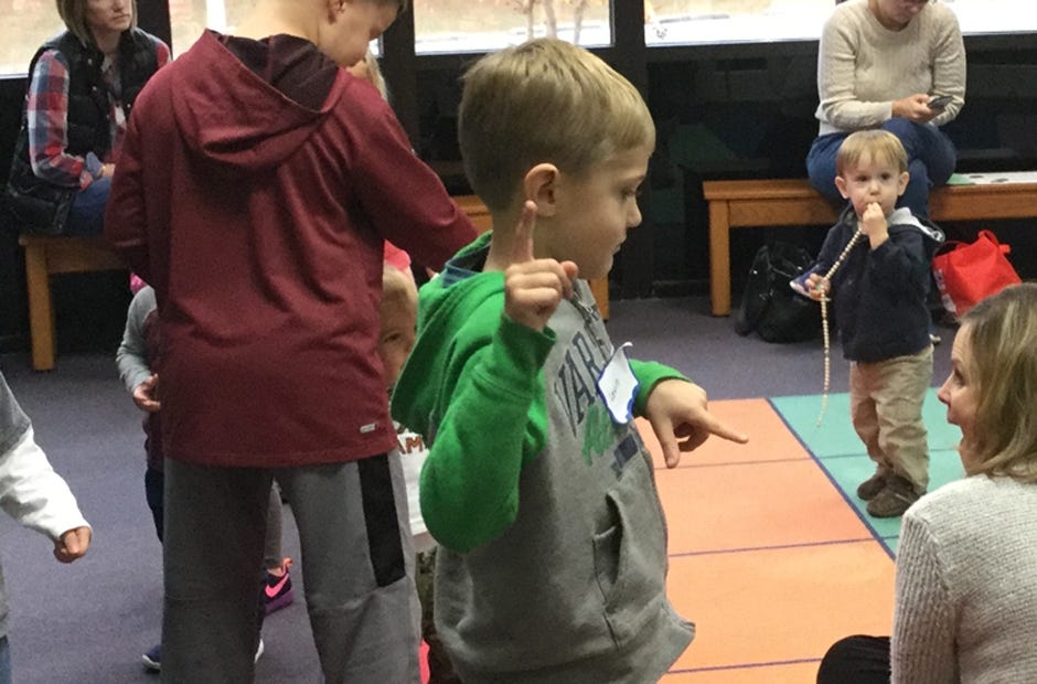 Levin Larson (center), 5, of Crestview, dances during Ages 3-5 Library Class Dec. 20 at the Crestview library. Special to the News Bulletin