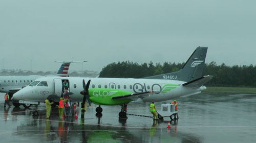 Passengers debark a GLO flight.