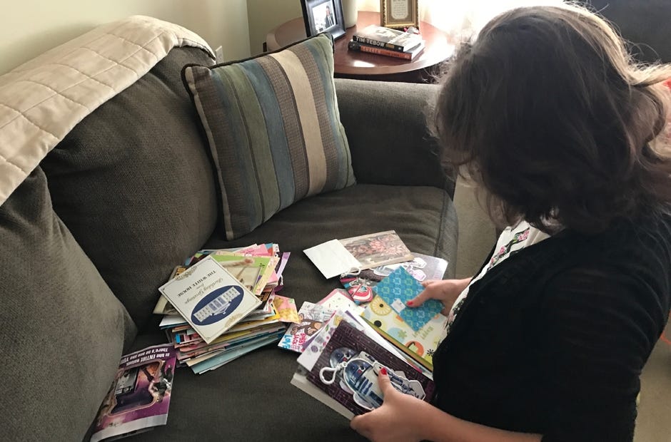 Jennifer Warren looks over some of the birthday cards she received after her sister posted to Facebook the girl's problems with school bullies. MARK JUDSON | News Bulletin
