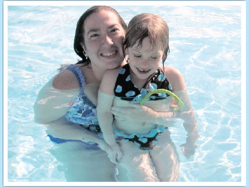 Katie Wilson plays in the Foxwood Country Club pool with her daughter, Amiira Walker, 5.