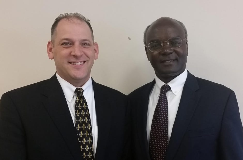 Fort Walton Beach Stake President Mike Roberts, left, stands with Elder Joseph Sitati, who spoke Jan. 21 during the Church of Jesus Christ of Latter-day Saints' Stake Conference Jan. 21 and 22 in Northwest Florida. Special to the News Bulletin