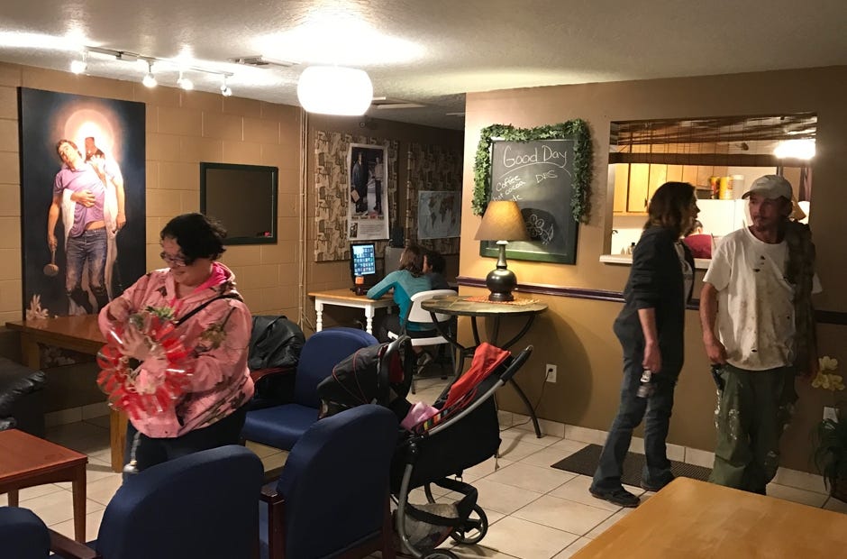 Visitors to Convergence Coffeehouse order free beverages during an adult night. MARK JUDSON | News Bulletin