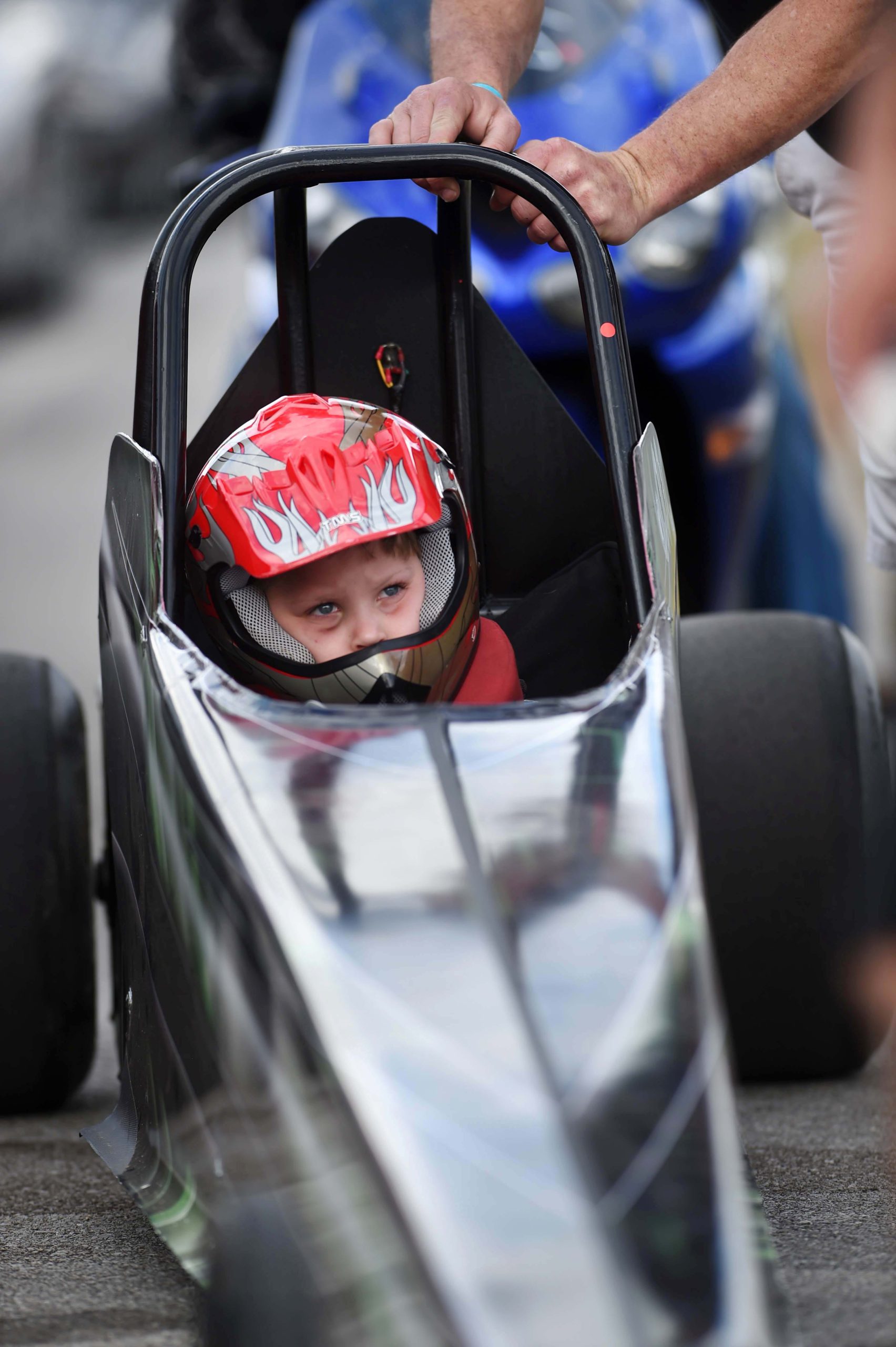 Five-year-old Camrin Paul of Daphne, Alabama, waits for his turn to race in the junior dragster division at Emerald Coast Dragway near Holt.

DEVON RAVINE/DAILY NEWS