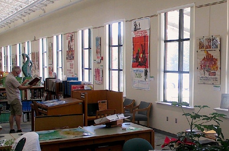 A Crestview Public Library patron reads books in front of an exhibit celebrating the 50th anniversary of the films of 1967 recently in the Crestview library. An Aug. 14 presentation by Northwest Florida State College film professor Dr. David Simmons examines the significance of the year in film. [Brian Hughes | Special to the News Bulletin]
