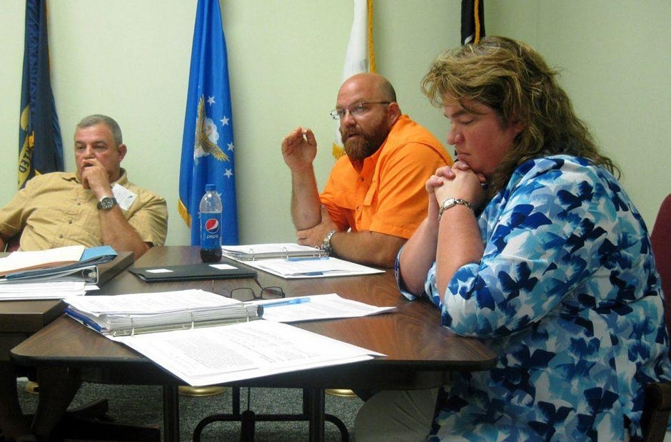 Laurel Hill City Council members Scott Moneypenny, Travis Dewrell and Debra Adams discuss local issues. FILE PHOTO
