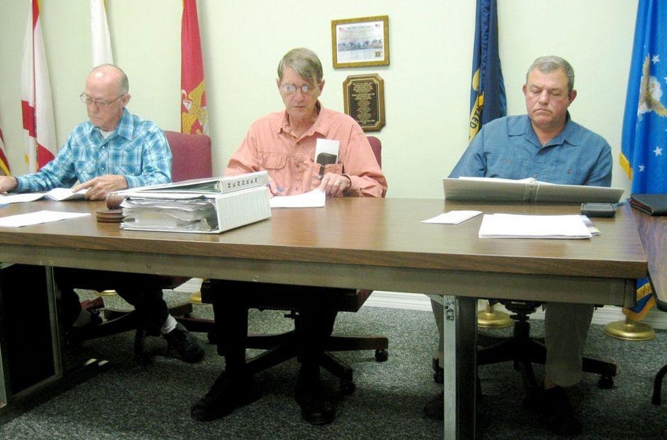 Road improvements on Third Street, Steel Mill Creek Road, Second Avenue and Eighth Street, along with water line renovations on Miller Street and Stokes Road, are expected if Laurel Hill receives a $600,000 development grant. Pictured are Laurel Hill City Council members Daniel Lane, Larry Hendren and Scott Moneypenny. [FILE PHOTO]