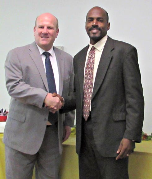 Walter Hooks (right), Regions Bank and 2016 United Way chair, welcomes Rick Owen, new United Way CEO, to the organization.