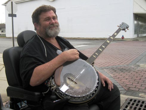 Rick "Banjo Bear" Edenfield is back on Main Street, playing his banjo after an eight-month absence.