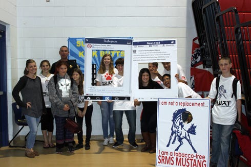 Students Working Against Tobacco members at Shoal River Middle School held a dodgeball tournament March 4 to promote Kick Butts Day and educate their peers on Big Tobacco’s marketing tactics. They are pictured with Crestview High School SWAT members and other Okaloosa officials. From left are Katy Houghton, SRMS teacher and faculty SWAT coordinator; SRMS students Abigail Lane and Autumn Lane; Deputy Sheriff Danny Dean, SRMS school resource officer; SRMS student Paige Power; CHS students Erika Newland and Brenden Mears; Nicole Partacz, health educator & SWAT coordinator for the Florida Department of Health; CHS students Ryan Takacs, Sean Gabany and Caleb Moody; and SRMS student Shawn Velsor.