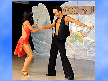 David Colon and Erika Moreno, of Fred Astaire Dance Studio of Crestview, swing their hips to spicy Latin beats.