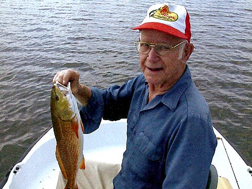 Leon Johns enjoys one of his favorite recreational activities: fishing. Many residents knew Johns from his downtown barbershop.