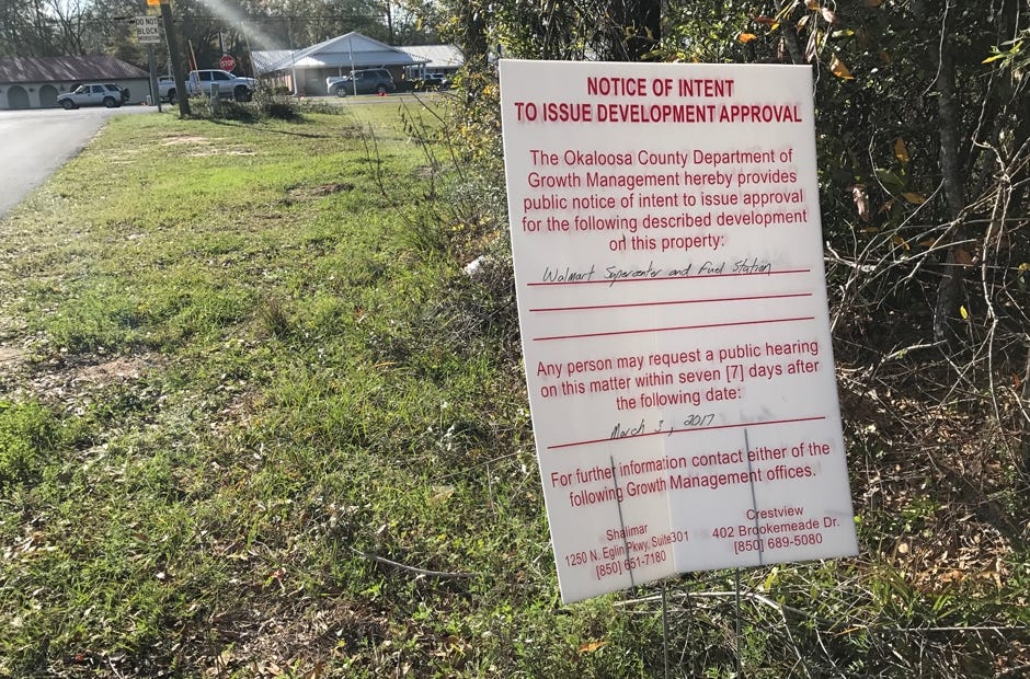 A sign indicates the proposed Walmart Supercenter location at Richbourg Lane and Industrial Drive. [MARK JUDSON/NEWS BULLETIN]