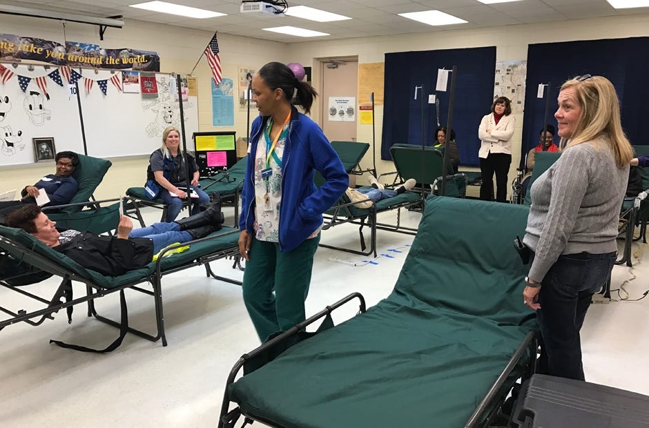 Volunteers participate in a mock emergency scenario at the Okaloosa County Special Needs Shelter. [MARK JUDSON/NEWS BULLETIN]
