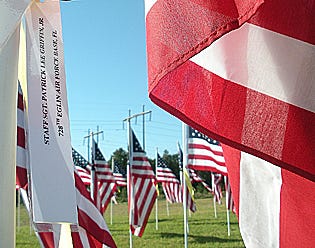 Flags at the Crestview Exchange Club’s annual Veterans Day display are posted in honor of specific veterans. This year’s display will be in front of Crestview High School Nov. 10-17.