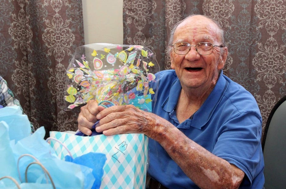 A man smiles after receiving a Jackson Hewitt gift bag April 7 in Crestview. [Special to the News Bulletin]