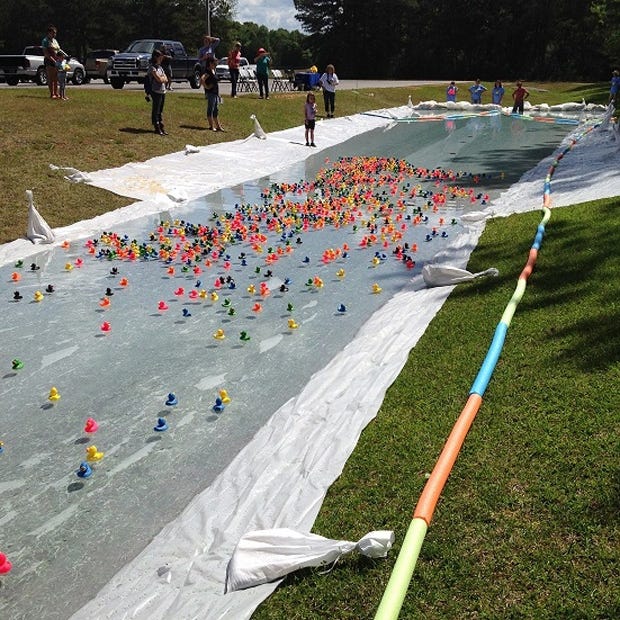 Several of the 1,000 rubber ducks purchased are pictured in the last stage of the April 22 race in Crestview. The fundraiser acquired $3,300 in scholarship money for technical education. [Special to the News Bulletin]