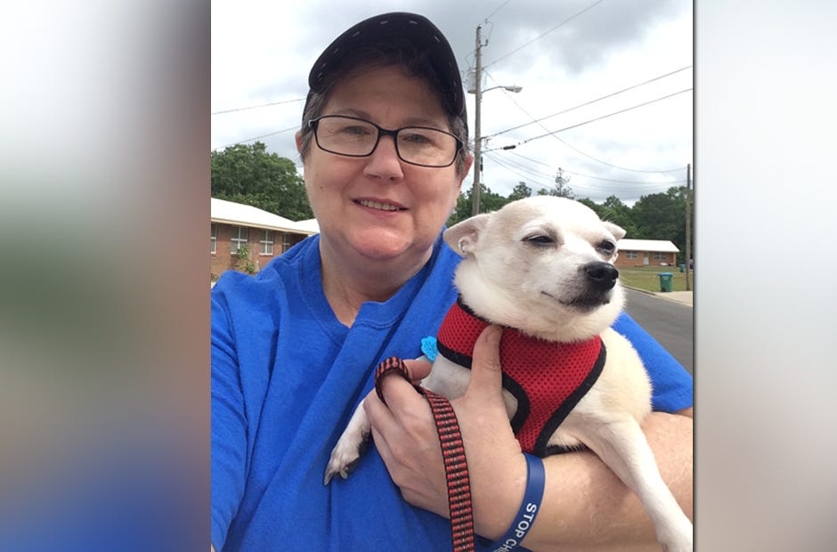 Lee Roberts of Crestview, pictured with her service dog, Otis, hosted an Advocates United for Humanity walk to raise awareness for child abuse April 29 in Crestview. She is an AUH cofounder. [AUH | Special to the News Bulletin]
