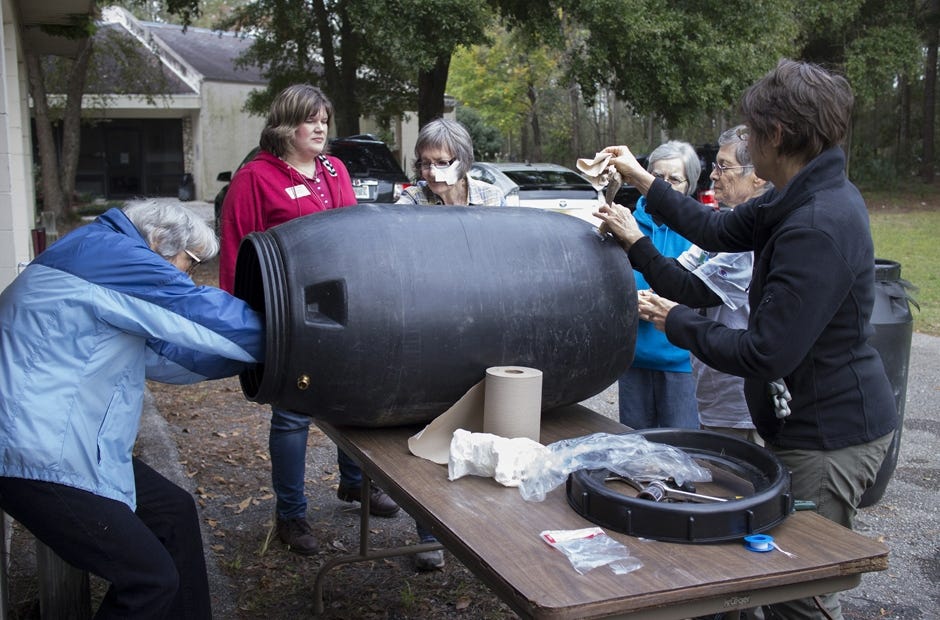 People work at a rain barrel building workshop Dec. 4, 2015, at the Alachua County Extension Office in Gainesville. [University of Florida IFAS Communications | Special to the News Bulletin]