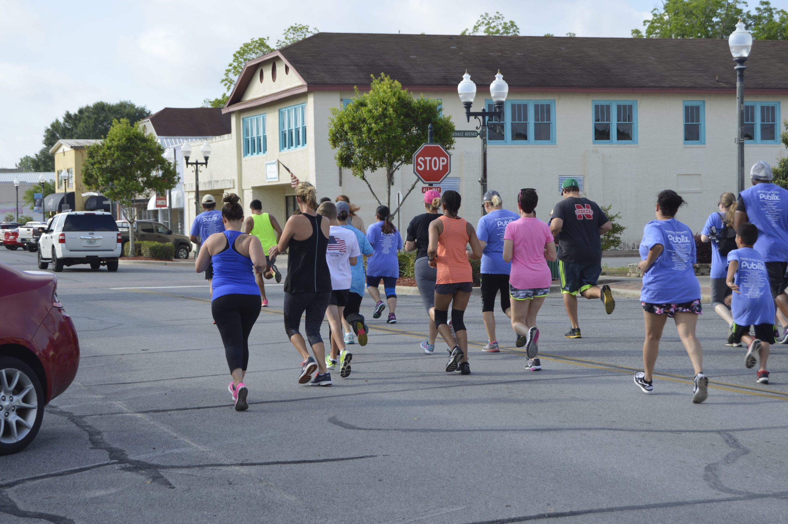 Runners with the first F.A.S.T. 5K begin the race and run down Crestview's Main Street. [ALICIA ADAMS/NEWS BULLETIN]