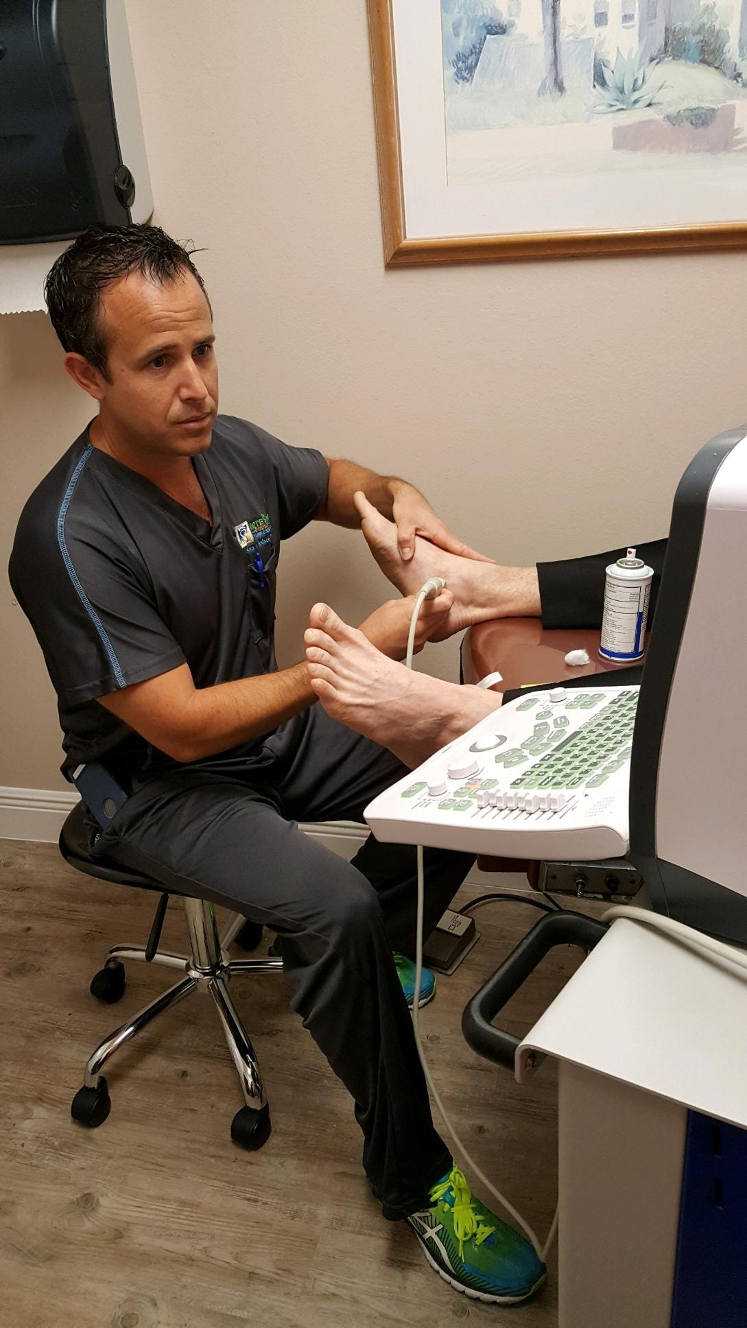 Sean Hodson, the podiatrist at White Sands Podiatry, performs an ultrasound guided injection for a patient with tendinitis. [Special to the News Bulletin]