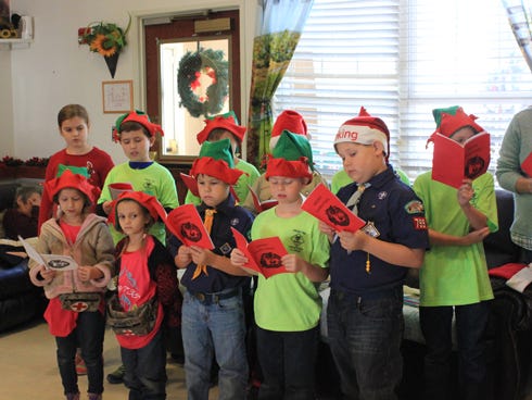 Cub Scout Pack 799 members visited Carrington Manor residents for Christmas. Pictured are, back row: Emily Chambliss, Alex Bryan, Riley Barringer, Ben Humphrey, Chase Nixon and Jesse Nixon. Front row: Josey Humphrey, Bernadette Humphrey, Bryce Zamorski, Thomas Chambliss and Jacek Zamorski. Not pictured: Johnny Humphrey, who operated the CD player.
