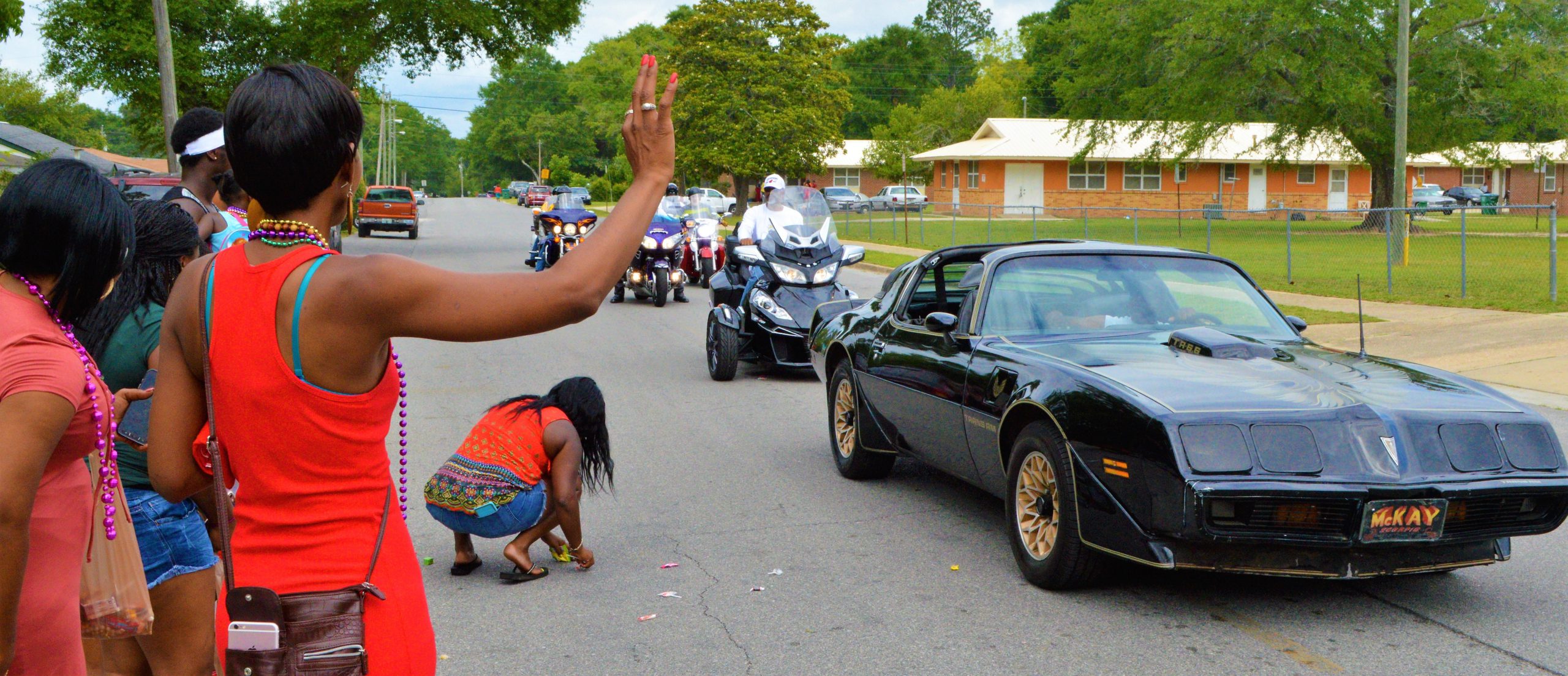 The Carver-Hill community takes part in a 41-year tradition lining the street for the May Day Parade. [JOHNNY C. ALEXANDER | News Bulletin]