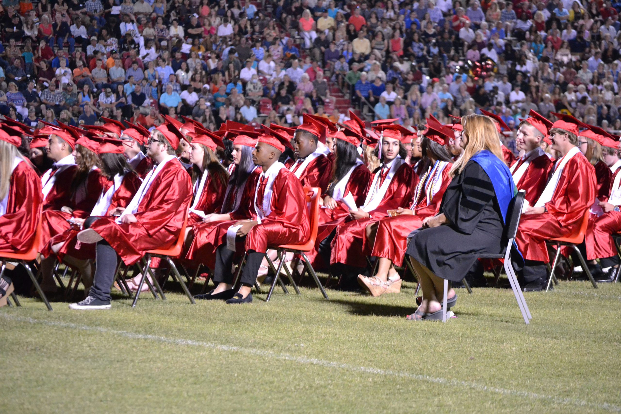 Seniors await the presentation of diplomas. [ALICIA ADAMS/NEWS BULLETIN]