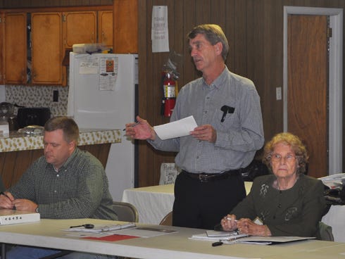 Laurel Hill City Council Chairperson Larry Hendren, center, speaks during a town hall meeting Tuesday night at First Baptist Church of Laurel Hill.