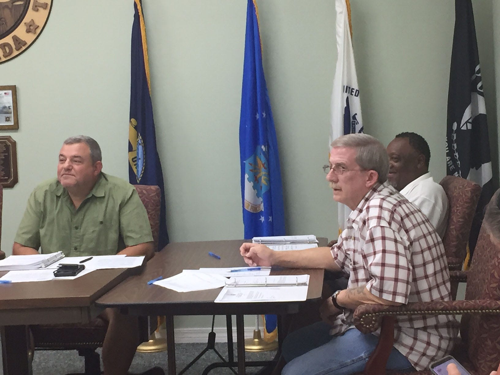 Laurel Hill City Council members listen to an audience member during Thursday's meeting. From left are Scott Moneypenny, Johnny James and Mike Blizzard. [Genevieve DiNatale | News Bulletin]